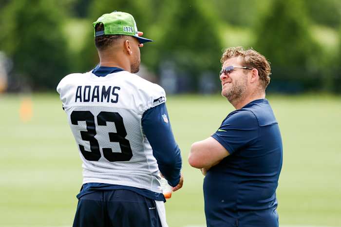 Seattle Seahawks strong safety Jamal Adams (33) talks with general manager John Schneider during minicamp practice at the Virginia Mason Athletic Center Field.